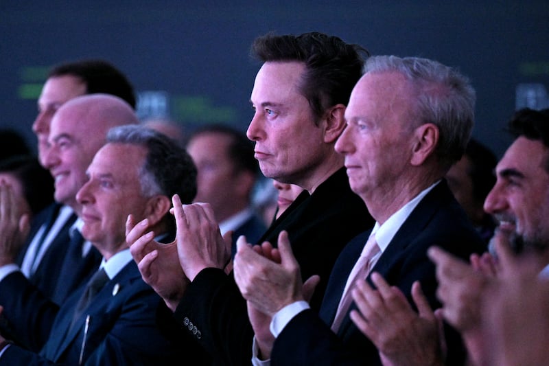 (L-R) Jared Kushner, FIFA President Gianni Infantino, US special envoy to the Middle East Steve Witkoff, Elon Musk, fomer CEO of Google Eric Schmidt and Governor of Public Investment Fund of Saudi Arabia Yasir Al-Rumayyan listen to US President Donald Trump speak at FII PRIORITY Miami 2025 Summit (Future Investment Initiative) at the Faena Hotel & Forum in Miami Beach, Florida, February 19, 2025.