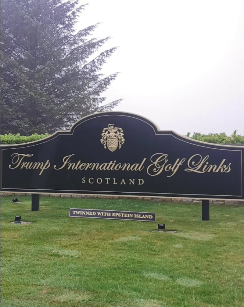 ABERDEEN, UK - JULY 21: (----EDITORIAL USE ONLY - MANDATORY CREDIT - 'EVERYONEHATESELON/ INSTAGRAM / HANDOUT' - NO MARKETING NO ADVERTISING CAMPAIGNS - DISTRIBUTED AS A SERVICE TO CLIENTS----) A sign reading 'Twinned with Epstein Island" was placed beneath the Trump International Golf Links sign in Aberdeen, Scotland, on Monday, July 21, 2025, ahead of President Donald Trump's visit. Trump is scheduled to travel to Scotland due to the Jeffrey Epstein report. The Wall Street Journal newspaper has recently released a bombshell report that has deepened the intrigue surrounding Trump and his connections to Epstein after the Justice Department announced last week that it determined Epstein died by suicide in 2019 and claimed he had no 'client list.'The announcement has sparked discontent within Trump's MAGA movement, with prominent voices demanding the release of all government documents related to Epstein. (Photo by Everyonehateselon_ Instagram Account / Handout/Anadolu via Getty Images)