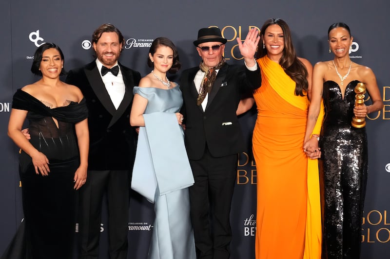 BEVERLY HILLS, CALIFORNIA - JANUARY 05: (L-R) Adriana Paz, Edgar Ramírez, Selena Gomez, Jacques Audiard, Karla Sofía Gascón, and Zoe Saldana, winners of the Best Motion Picture - Musical or Comedy award for “Emilia Pérez,” pose in the press room at the 82nd Annual Golden Globe Awards at The Beverly Hilton on January 05, 2025 in Beverly Hills, California. (Photo by Jeff Kravitz/FilmMagic)