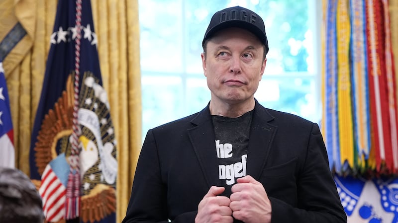 Elon Musk, sporting a black eye given to him by his son X, listens as President Donald Trump speaks to reporters in the Oval Office of the White House on May 30, 2025.