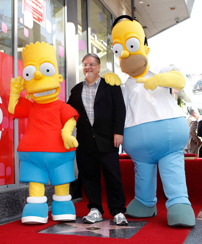 Matt Groening with Homer and Bart Simpson