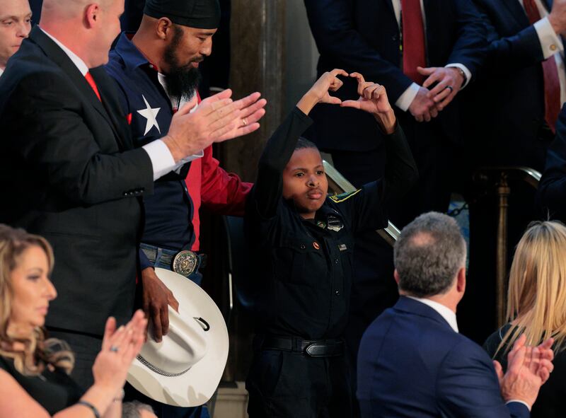 13-year-old cancer survivor Devarjaye "DJ" Daniel reacts during U.S. President Donald Trump's address to a joint session of Congress at the U.S. Capitol.