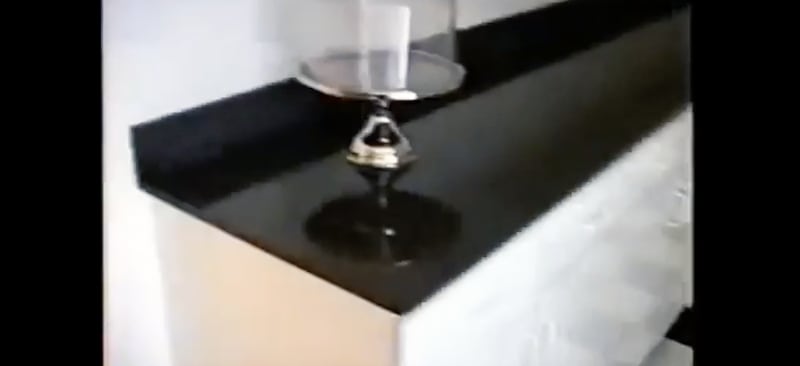 An empty cake stand is displayed on a countertop in a pantry in Jeffrey Epstein's Palm Beach mansion.