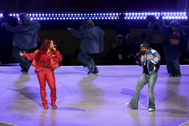 NEW ORLEANS, LOUISIANA - FEBRUARY 09: (L-R) SZA and Kendrick Lamar perform onstage during Apple Music Super Bowl LIX Halftime Show at Caesars Superdome on February 09, 2025 in New Orleans, Louisiana. (Photo by Cindy Ord/Getty Images)