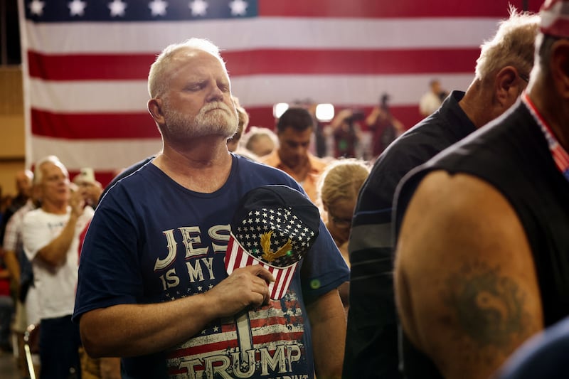 An attendee reacts as former U.S. President and Republican presidential candidate Donald Trump holds a campaign rally in Erie, Pennsylvania.