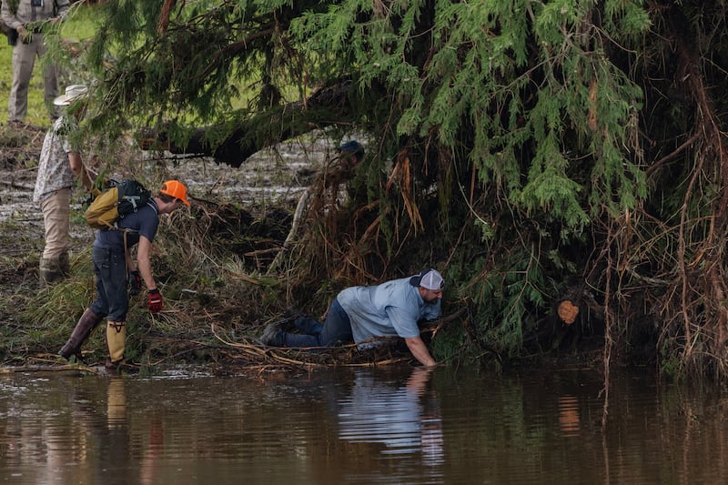 Search and recovery workers dig through debris looking for any survivors or remains of people swept up in the flash flooding near Camp Mystic on July 6, 2025 in Hunt, Texas.