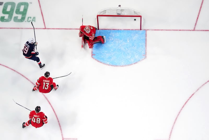 US Hockey player Jake Guentzel scores a goal during the first period of a game between the United States and Canada at Bell Centre on February 15, 2025 in Montreal, Quebec.