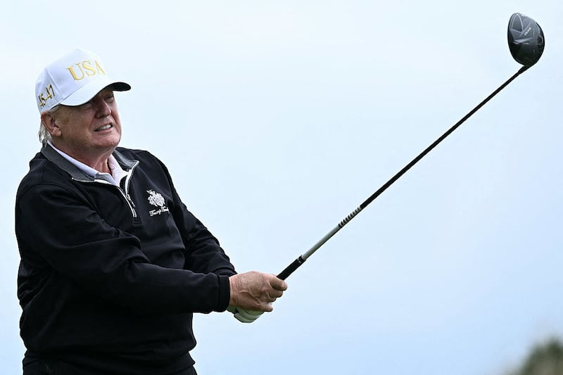 US President Donald Trump watches his drive after playing from the first tee to officially open the Trump International Golf Links course in Balmedie, Aberdeenshire, north east Scotland on July 29, 2025. (Photo by Brendan SMIALOWSKI / AFP) (Photo by BRENDAN SMIALOWSKI/AFP via Getty Images)