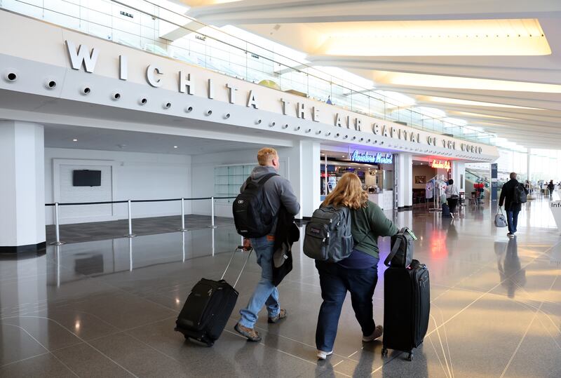 Travelers walk through Dwight D. Eisenhower National Airport on January 30, 2025 in Wichita, Kansas.