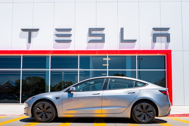 AUSTIN, TEXAS - JULY 24: A Tesla vehicle is parked outside of a dealership on July 24, 2025 in Austin, Texas. Tesla has reported a second consecutive quarter of year-over-year auto revenue decline as Elon Musk's automaker grapples with competition amongst other more affordable EV makers and the looming expiration of federal electric vehicle tax credits. (Photo by Brandon Bell/Getty Images)