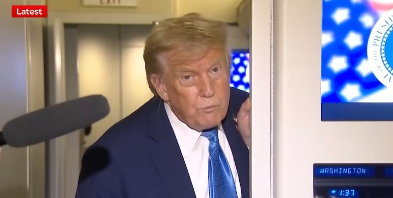 Trump takes questions on board Air Force One at 1:37 a.m. Tuesday.