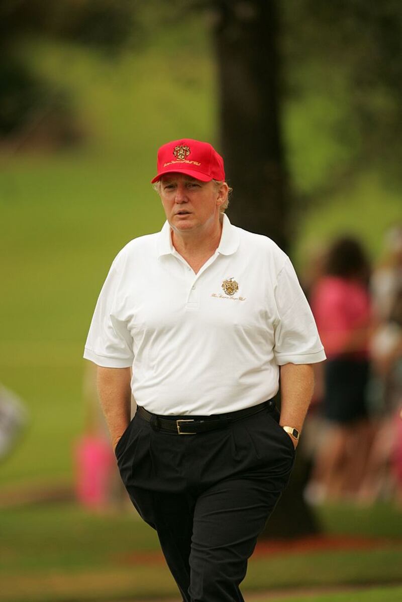 Donald Trump walks the course during a 2004 round at Trump International golf course in West Palm Beach, Florida.