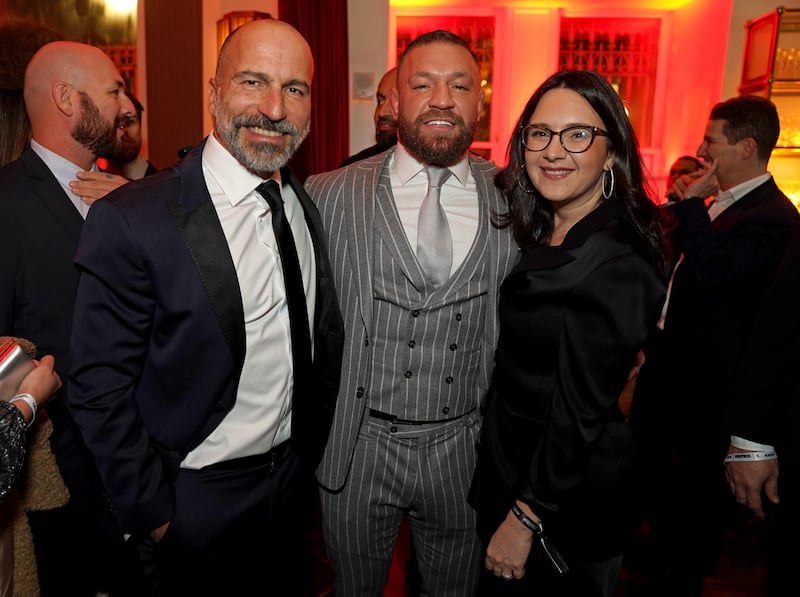 WASHINGTON, DC - JANUARY 19: (L-R) Dara Khosrowshahi, Uber CEO, Conor McGregor, and Bari Weiss, The Free Press Founder, attend Inauguration Eve hosted by Uber, X and The Free Press at Cafe Riggs on January 19, 2025 in Washington, DC. (Photo by Leigh Vogel/Getty Images for Uber, X and The Free Press)