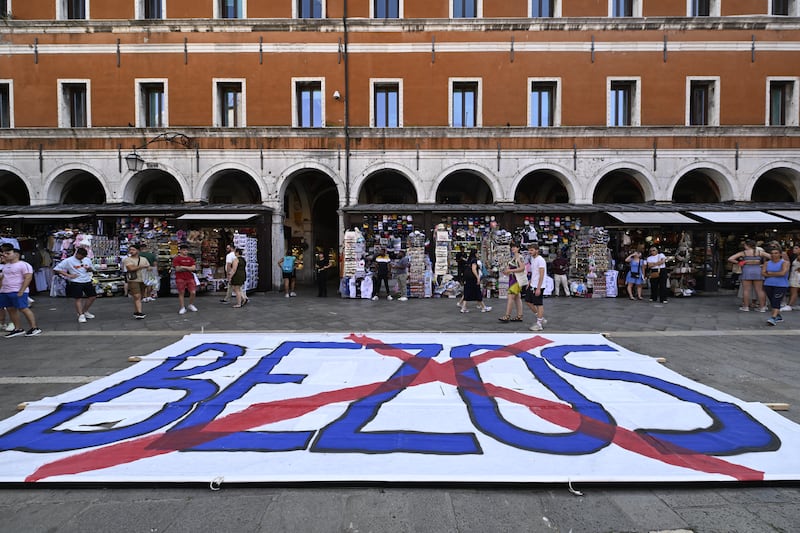 People gather to protest against the wedding of Amazon Founder and CEO Jeff Bezos and Lauren Sanchez in Venice.