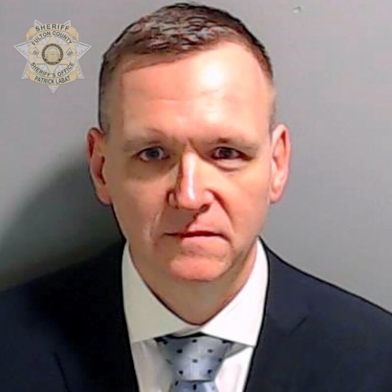 Michael Roman poses for his booking photo at the Fulton County Jail on Aug. 25, 2023 in Atlanta.