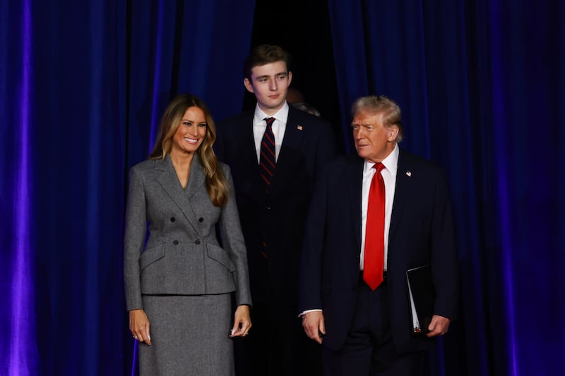 Melania Trump (L), Barron Trump (C), and Donald Trump (R)