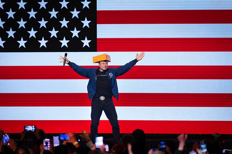 Billionaire businessman Elon Musk arrives for a town hall meeting wearing a cheesehead hat on March 30 in Green Bay, Wisconsin. The town hall was held in front of the state’s high-profile Supreme Court election.