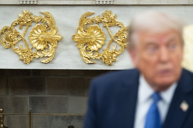 Gold colored decorations are seen as US President Donald Trump speaks during a bilateral meeting with Prime Minister of Norway Jonas Gahr Store in the Oval Office of the White House in Washington, DC, on April 24, 2025. (Photo by SAUL LOEB / AFP) (Photo by SAUL LOEB/AFP via Getty Images)