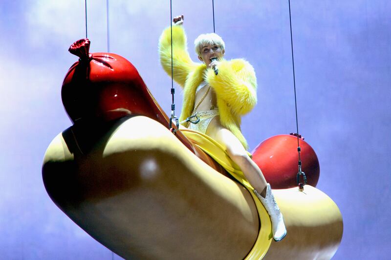 articles/2014/07/06/miley-cyrus-s-nbc-twerk-a-thon-tongues-leotards-and-dwarfs-oh-my/140704-stern-miley-tease_fdywoi