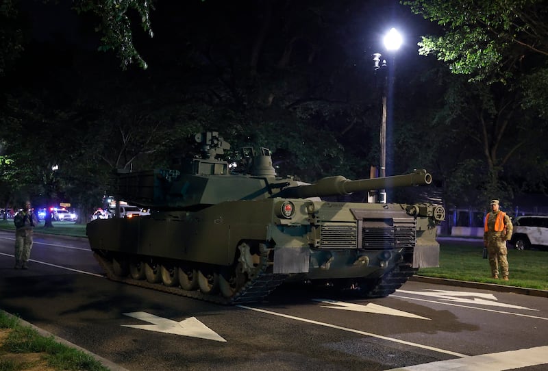 An Army M1 Abrams tank moves along Independence Avenue as it arrives ahead of the parade.