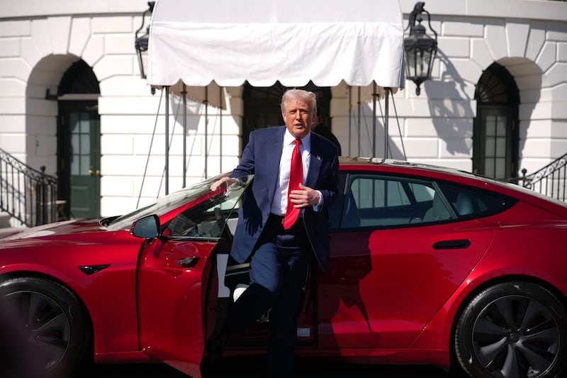 Donald Trump gets out of a Tesla Model S on the South Lawn of the White House.