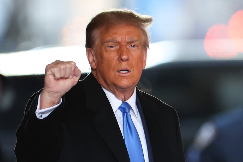 TOPSHOT - Former US President Donald Trump leaves Trump Tower for Manhattan federal court for the second defamation trial against him, in New York City on January 22, 2024. Writer E. Jean Carroll is seeking more than $10 million in damages in the civil trial, alleging that Trump defamed her in 2019 when he was president and she had just come out with her allegation, saying she "is not my type." This is separate to a civil case last year where another New York jury found Trump liable for sexually assaulting Carroll in a department store dressing room in 1996 and subsequently defaming her in 2022, when he called her a "complete con job." (Photo by Charly TRIBALLEAU / AFP) (Photo by CHARLY TRIBALLEAU/AFP via Getty Images)