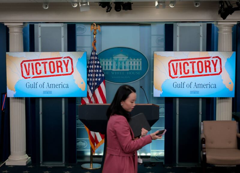 Television screens in the White House Press Briefing Room display a "Victory" sign after a judge refused to grant the Associated Press immediate access to the press pool.