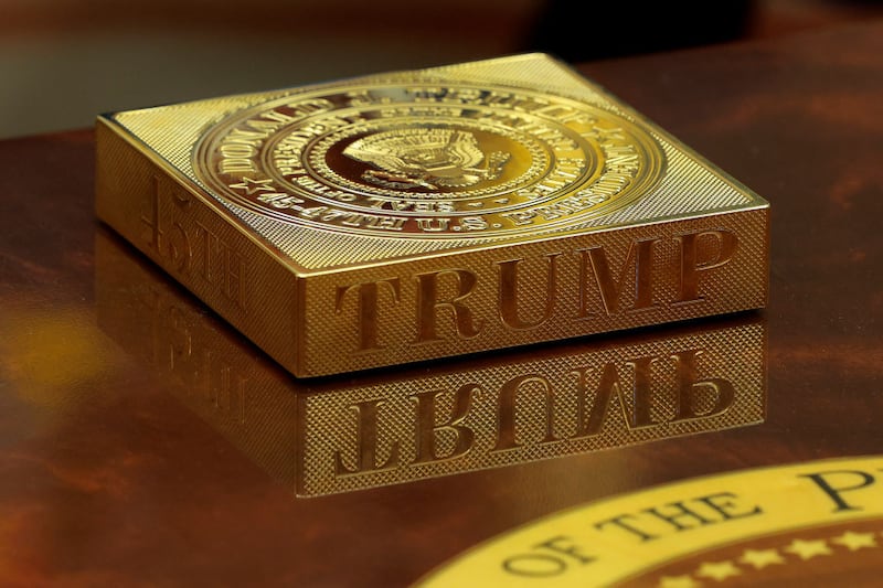 WASHINGTON, DC - FEBRUARY 24: A gold drink coaster box sits on U.S. President Donald Trump's coffee table as he hosts French President Emmanuel Macron for meetings in the Oval Office at the White House on February 24, 2025 in Washington, DC. Macron is meeting with Trump in Washington on the third anniversary of Russia's full-scale military invasion of Ukraine. (Photo by Chip Somodevilla/Getty Images)
