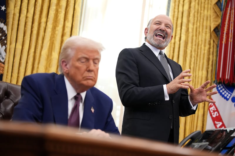 Secretary of Commerce Howard Lutnick speaks alongside President Donald Trump after Trump signed an executive order on "reciprocal" tariffs in the Oval Office at the White House on Feb. 13.