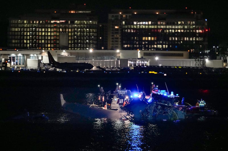 Emergency response units assess airplane wreckage in the Potomac River near Ronald Reagan Washington Airport on January 30, 2025 in Arlington, Virginia.
