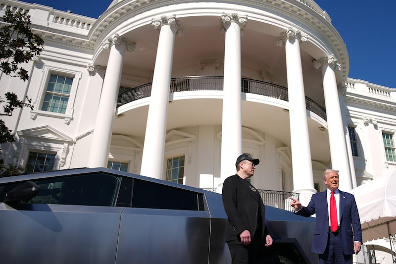 President Donald Trump and Tesla CEO Elon Musk deliver remarks next to a Tesla Cybertruck on the South Lawn of the White House on March 11, 2025 in Washington, D.C.