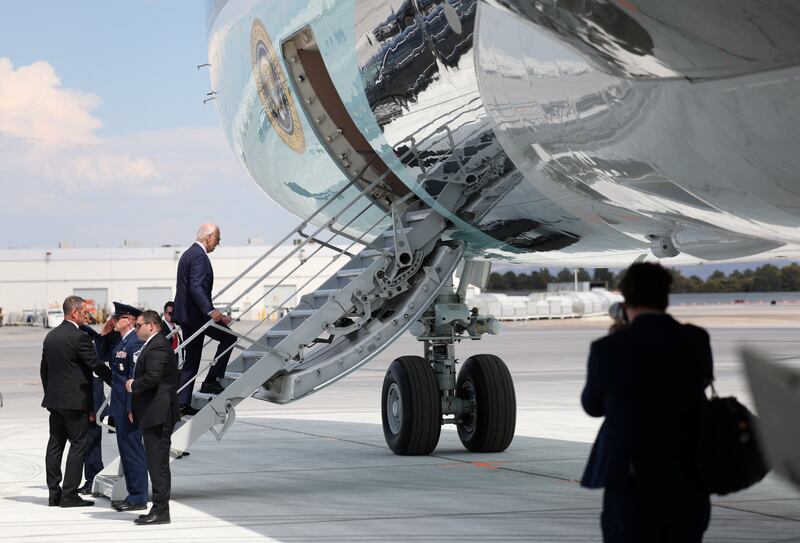 Joe Biden mounts stairs to Air Force One