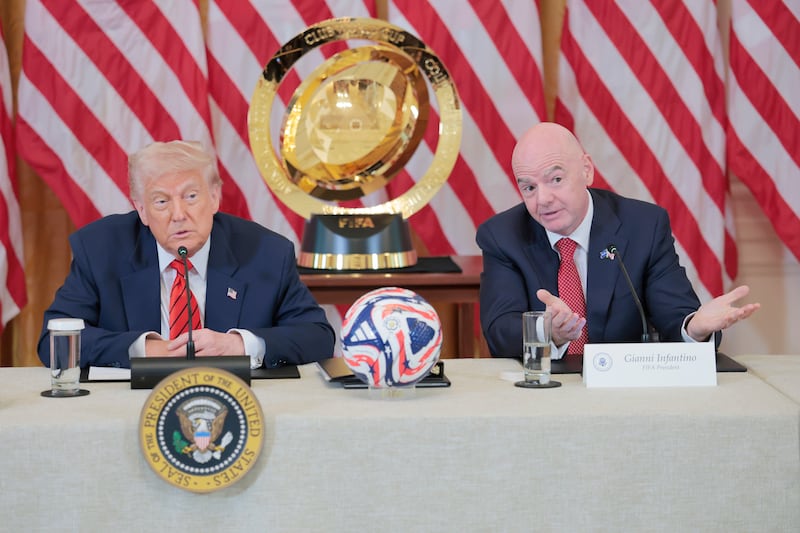 Donald Trump speaks alongside FIFA President Gianni Infantino.