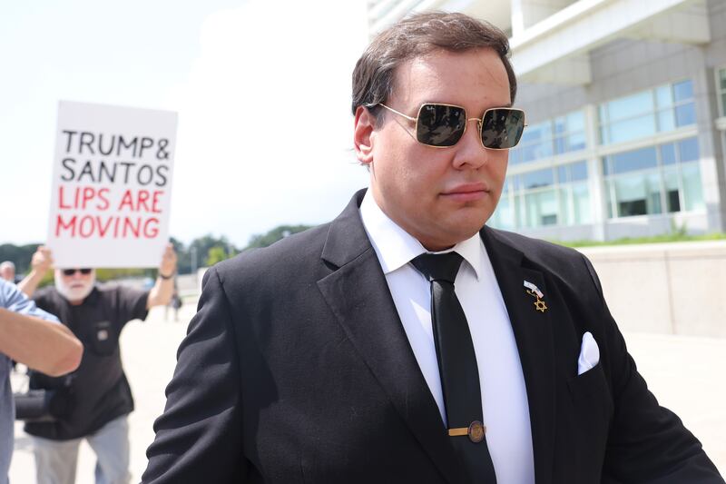 Former U.S. Rep. George Santos arrives for a court hearing at a U.S. District Court in New York on August 19, 2024.