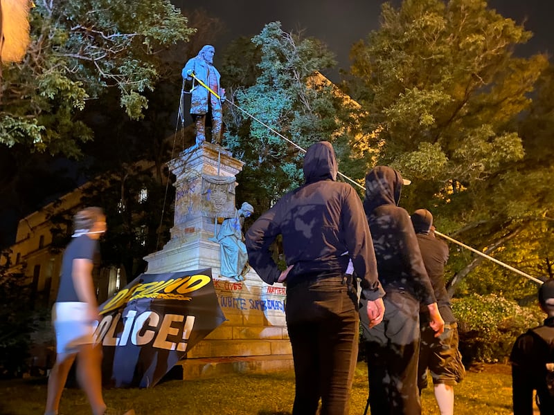 WASHINGTON, DC - JUNE 19: Demonstrators attempt to topple the Albert Pike Statue in Washington, DC on June 19, 2020. (Photo by Evelyn Hockstein for The Washington Post via Getty Images)