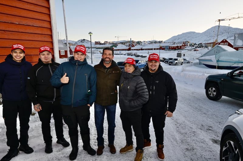 Don. Jr poses with Greenlanders on Tuesday.