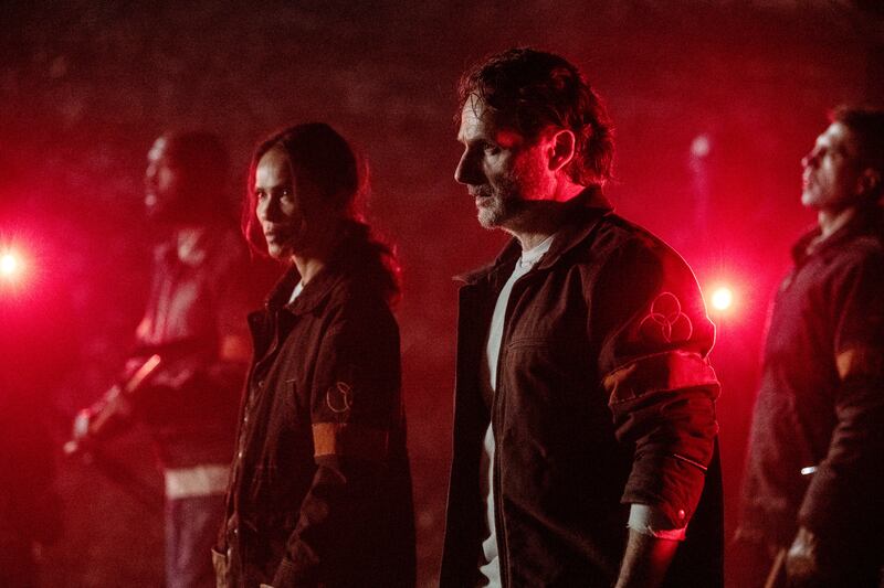 Andrew Lincoln as Rick Grimes and Lesley-Ann Brandt as Thorne in The Walking Dead: The Ones Who Live