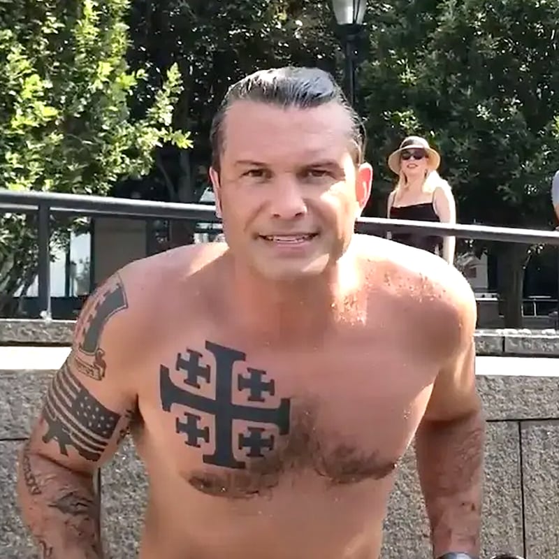 Pete Hegseth, shows his tattoos, including the Crusader cross on his chest.