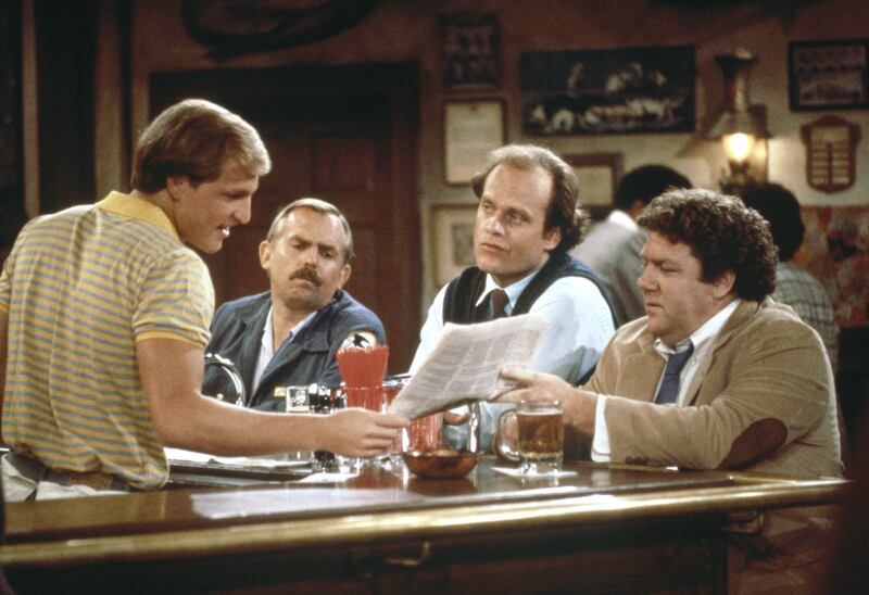 (l-r) Woody Harrelson as Woody Boyd, John Ratzenberger as Cliff Clavin, Kelsey Grammer as Dr. Frasier Crane, George Wendt as Norm Peterson in Cheers.