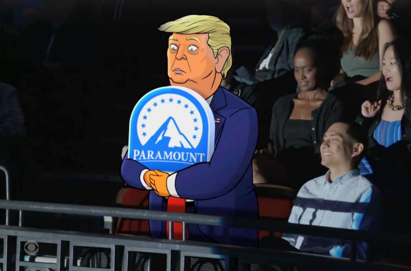Trump clutching the Paramount logo