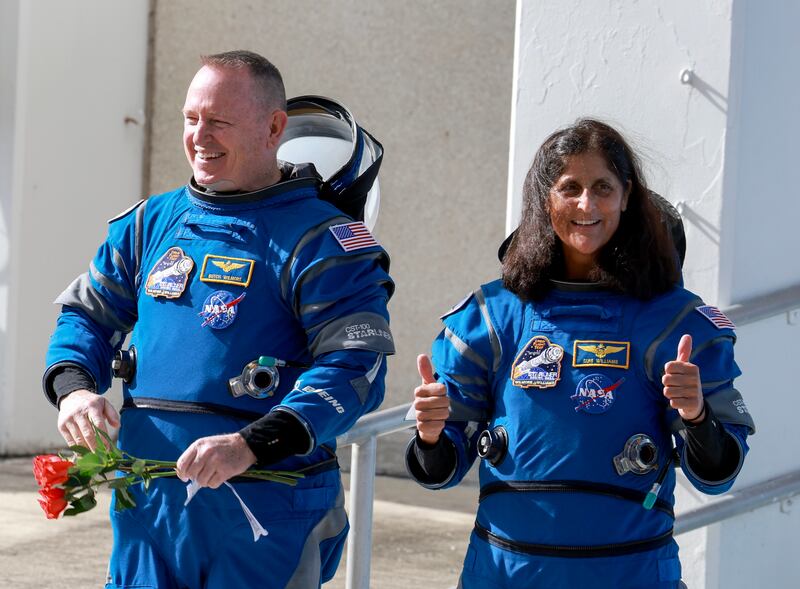 NASA’s Boeing Crew Flight Test Commander Butch Wilmore (L) and Pilot Suni Williams walk out of the Operations and Checkout Building on June 01, 2024 in Cape Canaveral, Florida.