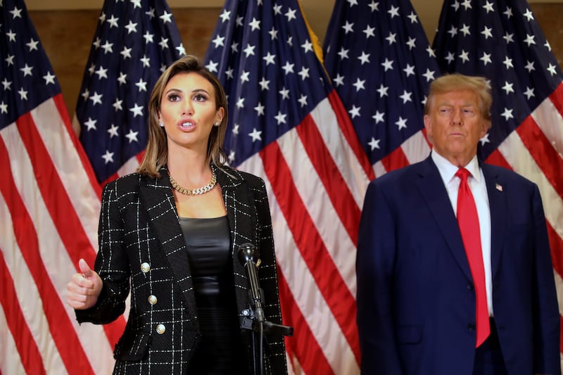 Former U.S. President Donald Trump stands with his lawyer Alina Habba as she speaks to the media at one of his properties, 40 Wall Street, following closing arguments at his civil fraud trial on January 11, 2024 in New York City.
