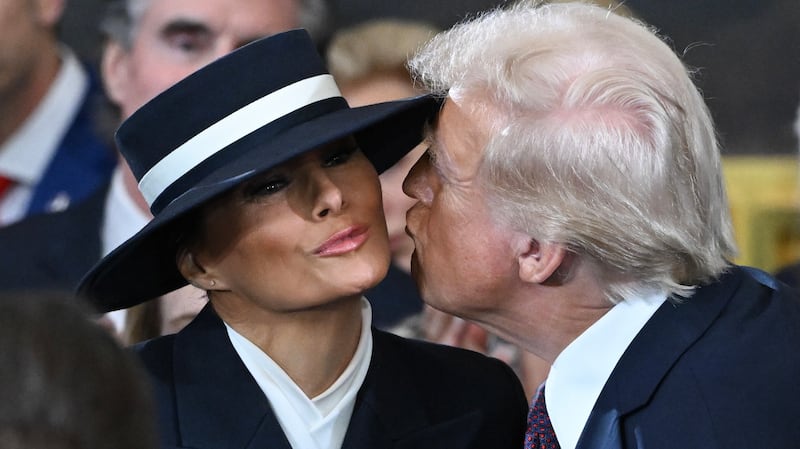 Donald Trump kisses Melania Trump at his inauguration on January 20, 2025.
