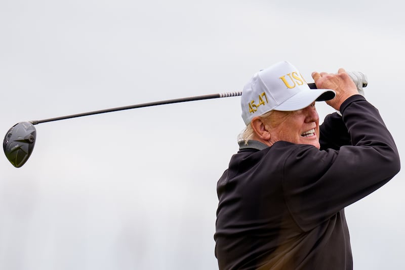 President Donald Trump tees off at a new 18-hole course at Trump International Golf Links on July 29, 2025 in Balmedie, near Aberdeen, Scotland.