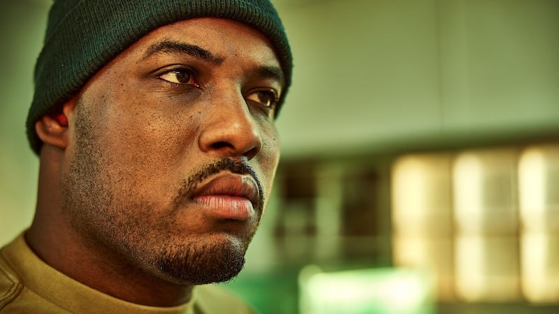 A headshot of Lionel Boyce as Marcus in the show The Bear.