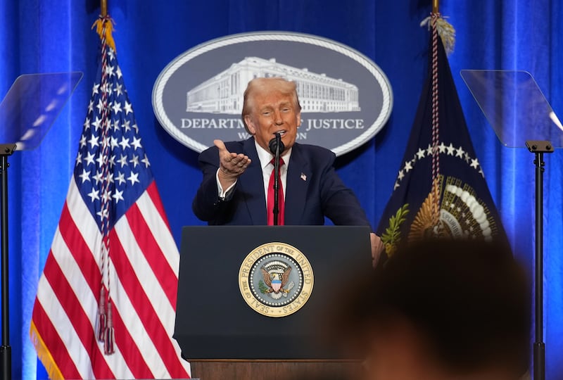 U.S. President Donald Trump gestures while speaking at the Justice Department March 14, 2025 in Washington, DC.