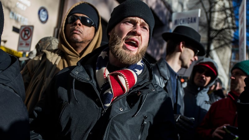 RICHMOND, VA - JANUARY 20: InfoWars host Owen Shroyer speaks during a rally organized by The Virginia Citizens Defense League on Capitol Square near the state capitol building on January 20, 2020 in Richmond, Virginia. During elections last year, Virginia Governor Ralph Northam promised to enact sweeping gun control laws in 2020, including limiting handgun purchase to one per month, banning military-style weapons and silencers, allowing localities to ban guns in public spaces and enacting a 'red flag' law so authorities can temporarily seize weapons from someone deemed a threat. While event organizers have asked supporters to show up un-armed, militias and other far-right groups from across the country plan to attend the rally and show their support for gun rights.