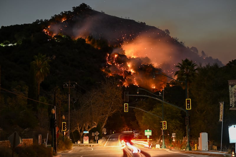 A view of flames at the mountain as seen from Topanga Canyon near Pacific Palisades in Topanga, Los Angeles, California on January 9, 2025.
