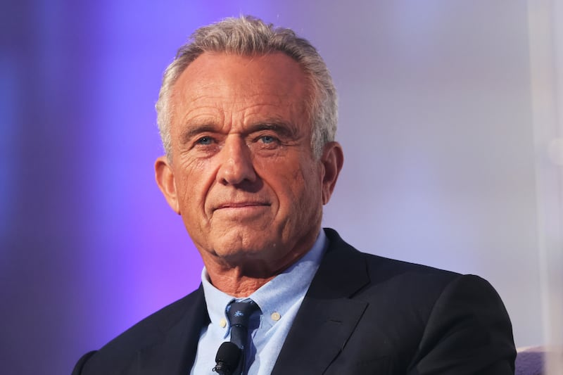 Robert F. Kennedy Jr. listens as he is introduced by Rabbi Shmuley Boteach during the World Values Network's Presidential candidate series at the Glasshouse on July 25, 2023 in New York City.