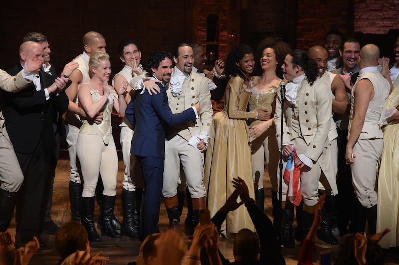 Music director Alex Lacamoire and actor, composer Lin-Manuel Miranda and cast of "Hamilton" celebrate on stage the receiving of GRAMMY award after "Hamilton" GRAMMY performance for The 58th GRAMMY Awards at Richard Rodgers Theater on February 15, 2016 in New York City.